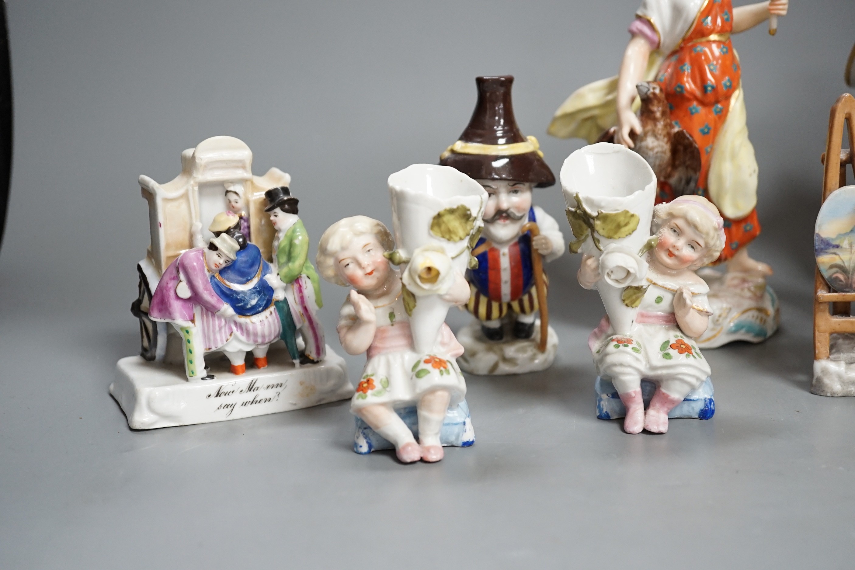 A selection of mainly Continental porcelain figures including Royal Crown Derby style mansion house dwarf
